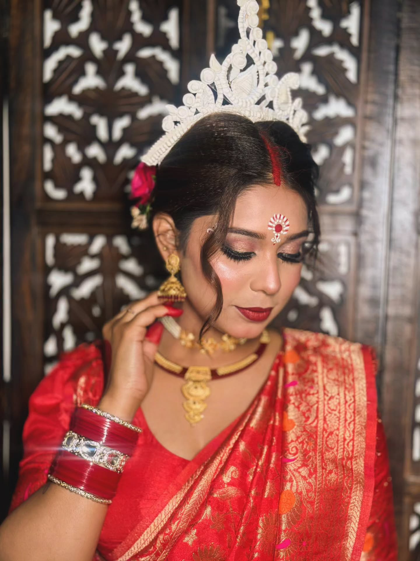 Traditional bridal makeup with mukut crown